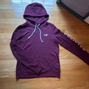 Hollister, size small, a darker maroon red color